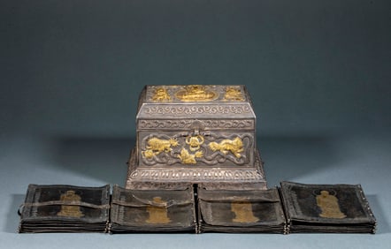 A four-volume silver-gilt collection box of the Buddha's Teachings on the Practice of Bodhisattva