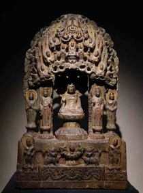 A Tang Dynasty blue stone painted and hollowed-out backrest Buddha