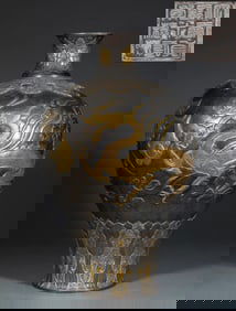 A silver vase with gilded dragon and phoenix auspiciousness from the Zhenguan period of the Tang