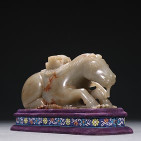 A Qing Dynasty Hetian jade seed material seahorse with a book on it