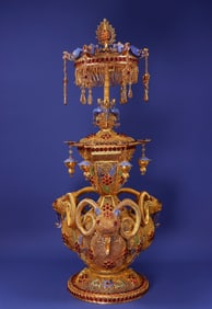 A Qing Dynasty filigree, gilded, gemstone-inlaid and blue-fired "Three Yangs Bring Good Fortune"