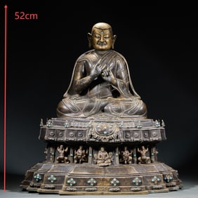 A Buddha statue of the master inlaid with turquoise in alloy copper