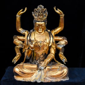 A gilded bronze statue of the Thousand-Handed Guanyin inlaid with gemstones before the Ming Dynasty