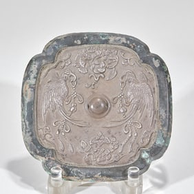 A silver-inlaid double happiness bronze mirror before the Ming Dynasty