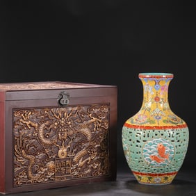 A Qing Dynasty Qianlong enamel-painted hollowed-out window fish-patterned bamboo basket vase