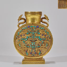 A Qianlong-period gold vase inlaid with turquoise, decorated with a beast mask motif holding the