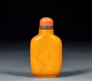 An amber snuff bottle