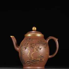 A gold-painted and engraved landscape tea pot with three feet and two ears, marked with the reign of