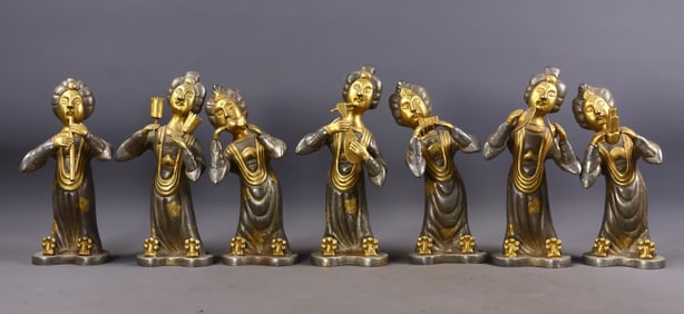 A set of seven gilded and engraved musicians