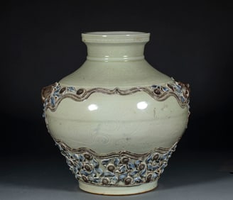 A pre-Ming Dynasty stoneware jar with lion-shaped handles