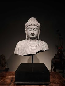 A half-length statue of Vairocana Buddha in Qing Dynasty, carved from bluestone