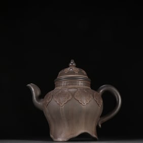 A purple clay teapot with flower-shaped inlaid patterns by Chen Mingyuan