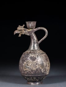 Silver ewer with flower patterns and phoenix-shaped spout