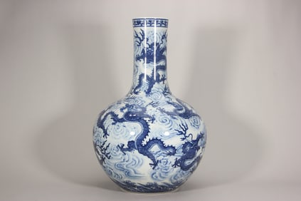 A blue and white porcelain globe-shaped vase with dragon and wave patterns from the reign of Emperor