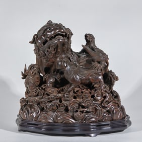 A pair of lion figurines made of agarwood