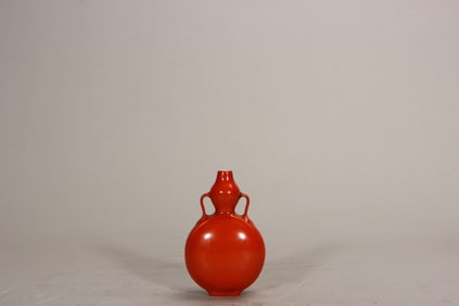 A moon flask with a red glaze and a ribbon handle, Qing Dynasty, Qianlong period