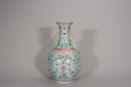 Qianlong period turquoise ground with flower of paradise double-ear vase