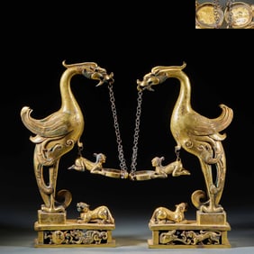 Pair of Gilt Bronze Lampstands with Human and Auspicious Beast Motifs, Pre-Ming Dynasty