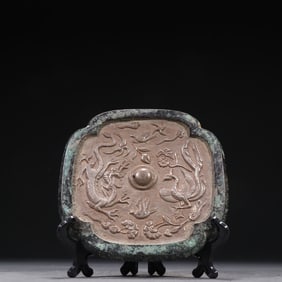 Tang Dynasty Bronze Mirror with Silver Inlay and Chased Dragon-Phoenix Patterns