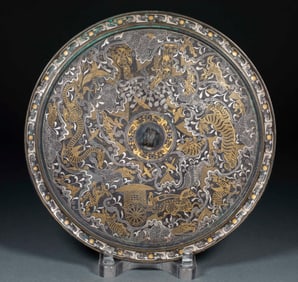 Gilt-silver Inlaid Bronze Mirror with Divine Beasts and Chariot-and-Horse Patterns of the Han