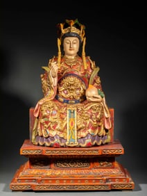 A lacquered and gilded wooden statue of Mazu with colored patterns