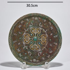 A copper mirror with inlaid silver and gold and a dragon pattern from before the Ming Dynasty