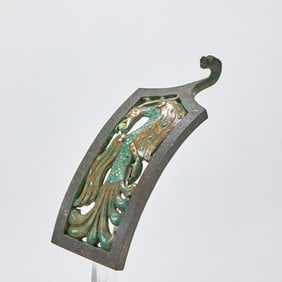 A pair of bronze hooks with inlaid silver and gold and turquoise and phoenix patterns from the