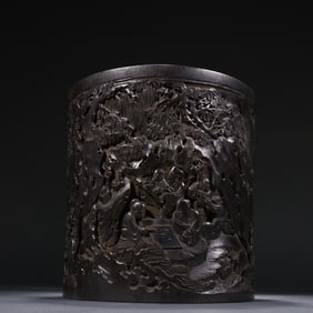 A pen holder with figures and stories carved from rosewood from the Qing Dynasty