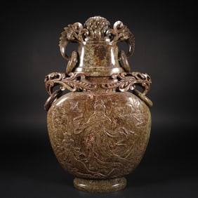 Jade bottle with a child paying homage to Guanyin, Hetian seed jade