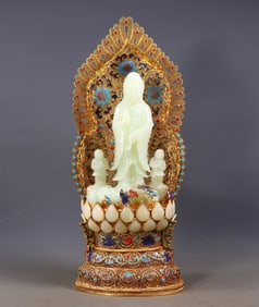 A filigree gilded and inlaid Hetian white jade statue of Guanyin presenting a child