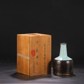 Southern Song Dynasty Longquan Kiln celadon with silver rim and paper-wrapped base bottle