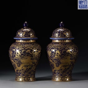 A Pair of Qianlong Reign Marked Lidded Jars with Blue Ground and Gilded Dragon Motifs