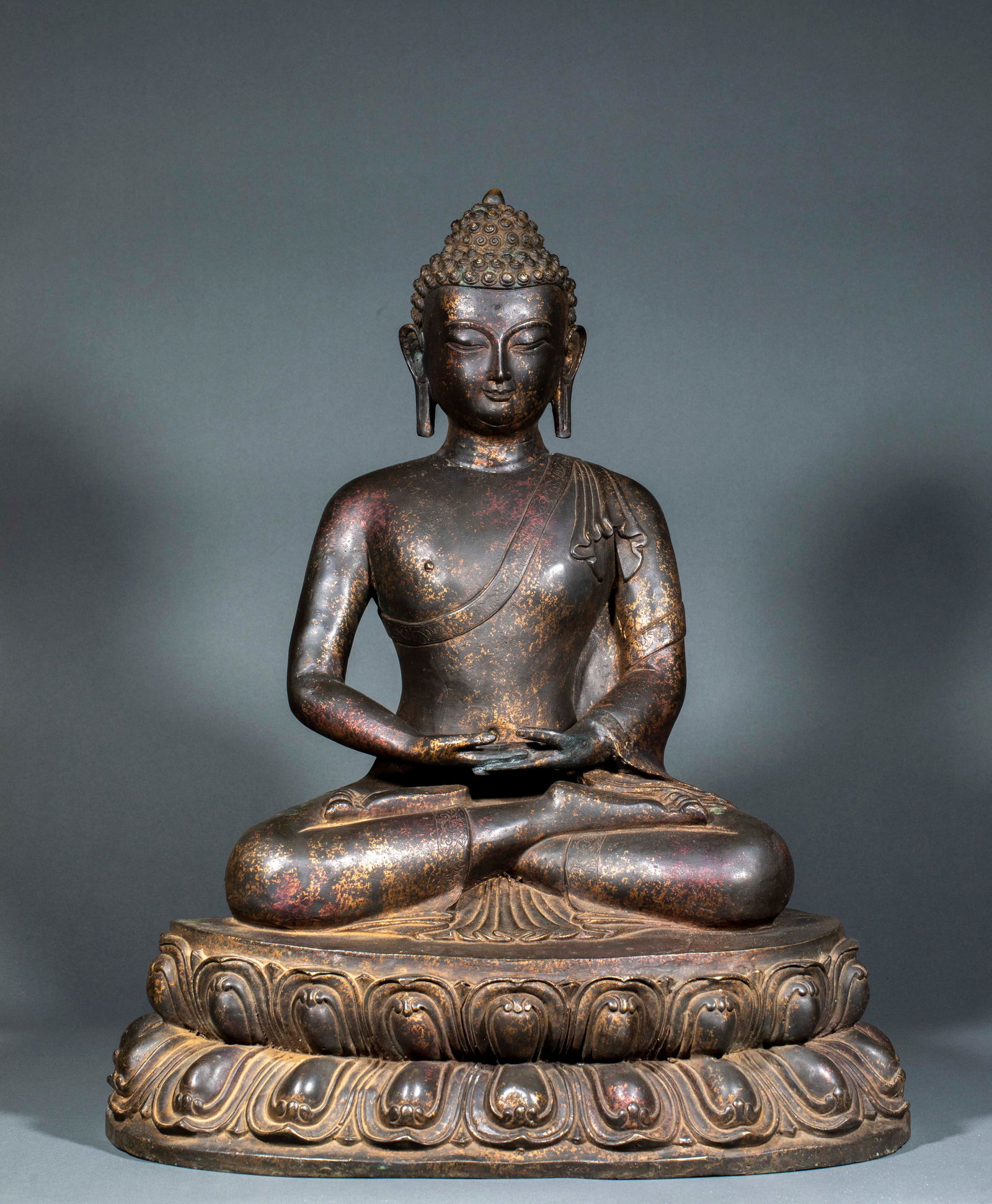 Gilt Lacquered Bronze Shakyamuni Buddha Statue: Bronze Lacquered Gold Sakyamuni Buddha Statue Made of bronze with lacquered gold craftsmanship, this seated Sakyamuni Buddha statue measures 60 cm in height, 48.5 cm in length, 36 cm in width and weig