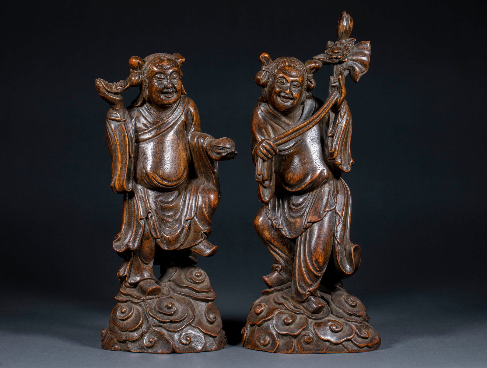 Qing Dynasty Agarwood Hehe Erxian (Immortals of Harmony and Union): Qing Dynasty Eaglewood Carving of Hehe Erxian (Two Immortals of Harmony and Union) : Carved from precious eaglewood, this pair of statues depicts the Hehe Erxian, symbols of harmony and marital bliss,