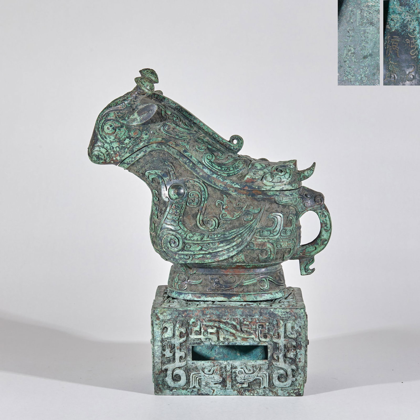 Shang Dynasty "Fu Ji" Bronze Gong (Ritual Wine Vessel): Shang Dynasty Bronze Gong "Fu Ji" : Cast from bronze, this ritual gong features taotie patterns and inscriptions of "Fu Ji", measuring 35 cm in height, 25 cm in length, 16 cm in width; the intricate