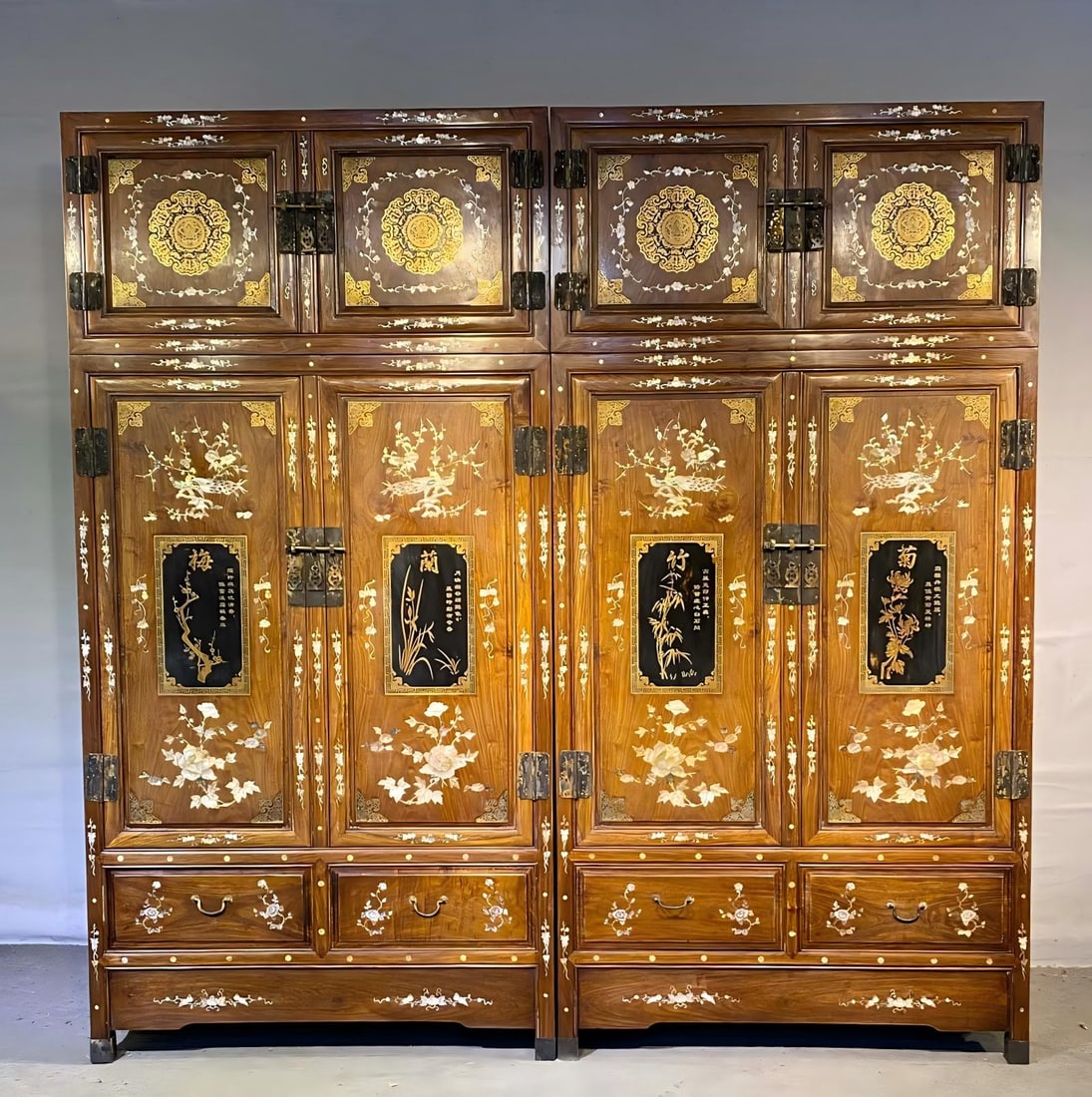 Huanghuali Cabinet Fully Wrapped in Copper and Inlaid with Shell: Pair of Huanghuali Wood Cabinets with Copper Mounts and Mother-of-Pearl Inlay : Crafted from rare huanghuali wood, these massive cabinets feature elaborate mother-of-pearl inlay of the "Four