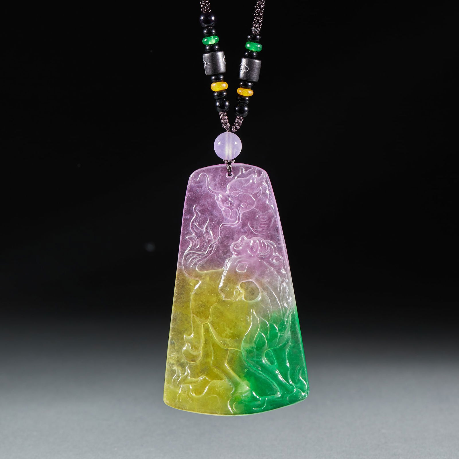 Jadeite Pendant of “Dragon?Horse Spirit: Jadeite "Dragon-Horse Spirit" Pendant: Material is natural tri-color (purple, yellow, green) jadeite carved with "Dragon-Horse Spirit" pattern via jade relief technique, length 9.1cm, width 5.3cm,