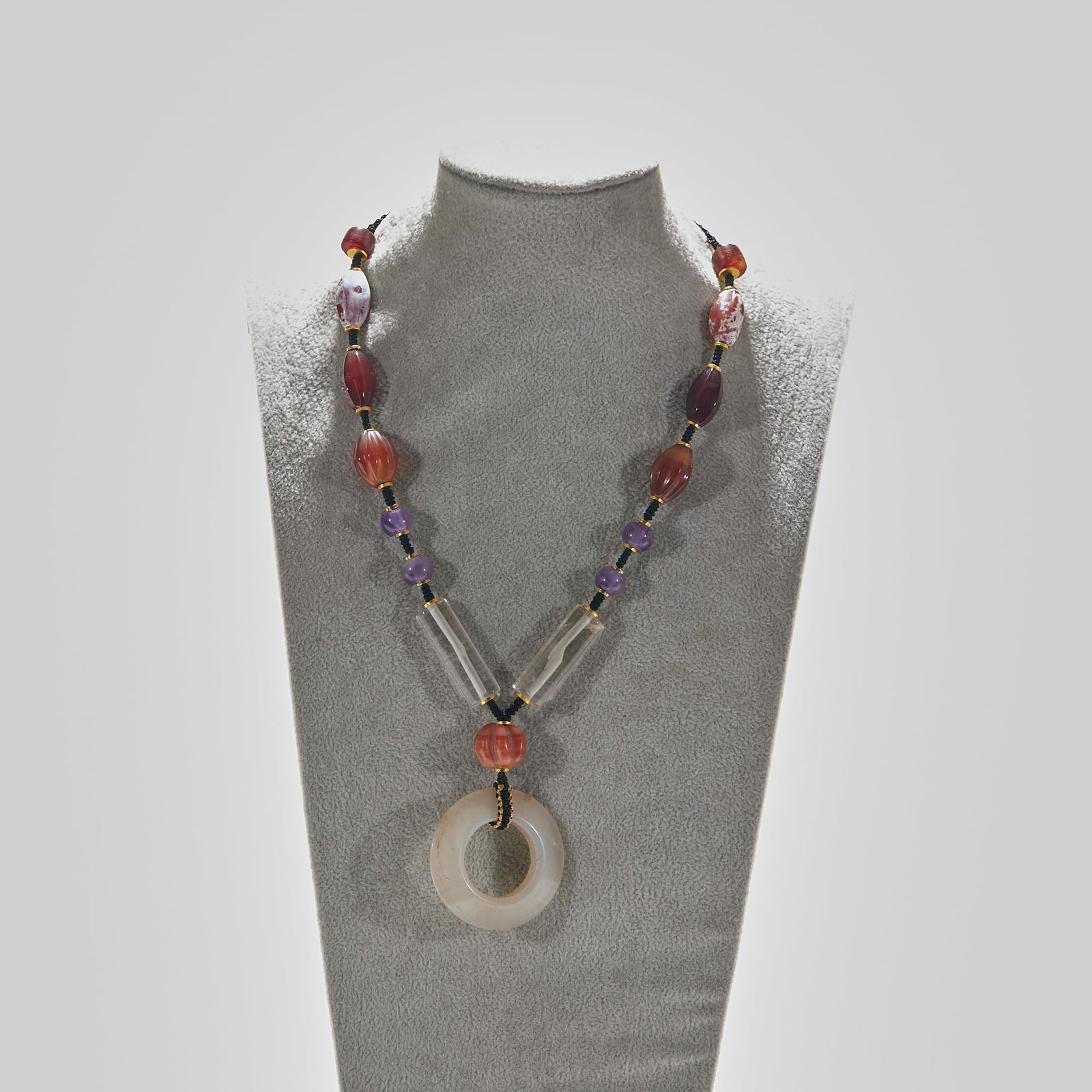 Agate and Crystal Pendant: Agate and Crystal Pendant: Material is agate and crystal, made into a pendant via grinding and stringing techniques, ring diameter 4.5cm, cultural value: agate and crystal are classic materials of