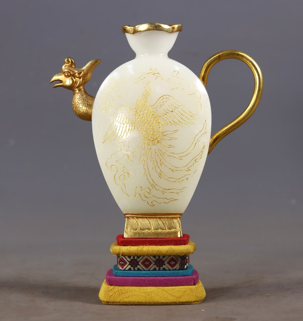 Gilt Silver-mounted Hetian White Jade Ewer with Phoenix Mouth: Hetian White Jade Ewer with Gilt Silver Mounted Phoenix Mouth: Made of Hetian white jade as the pot body, combining mounting and gilt silver techniques, featuring vivid phoenix mouth shape and gilt