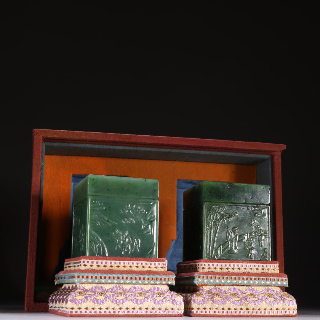 Pair of Green Jade Lidded Boxes with Figure Stories, Qing Dynasty: Pair of Qing Dynasty Green Jade Lidded Boxes with Figure Stories: Made of green jade via relief and polishing techniques, carved with figure story patterns, featuring regular lidded box shape, single