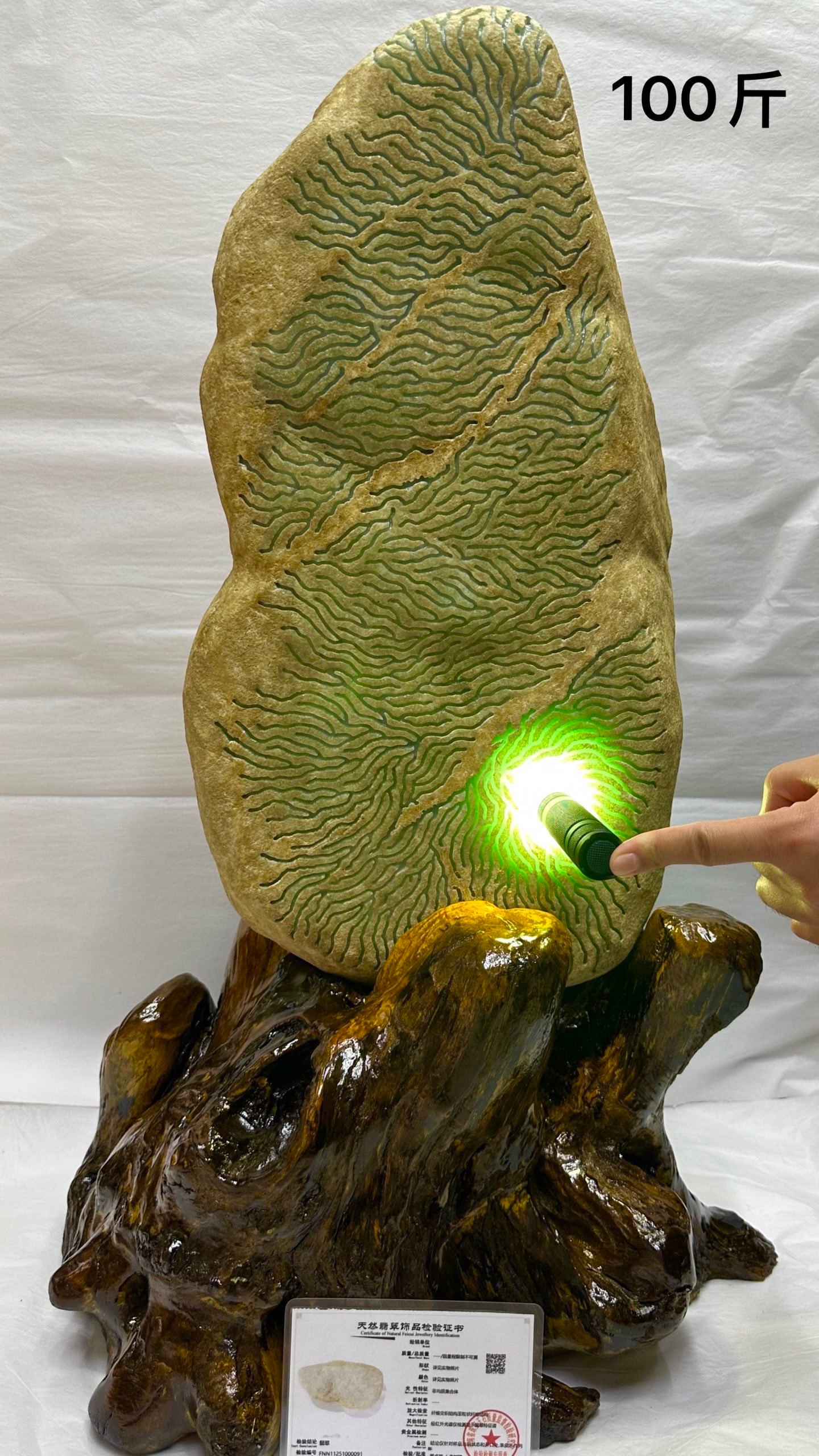 High Ice Full Green Jadeite Rough Stone: High Ice Full Green Jadeite Rough Stone: Material is natural jadeite, treated with large-area "water ripple" window-opening technique to display internal texture, specifications height approx. 50cm, w