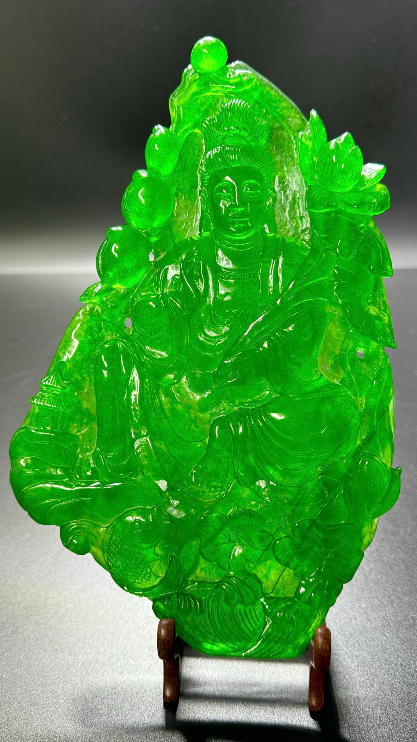 Ice-Transparent Full Green Jadeite: Lotus Guanyin: Ice-Transparent Full Green Jadeite Lotus Guanyin Statue: Material is ice-transparent full green jadeite, carved into Sakyamuni Buddha (Lotus Guanyin) statue via round carving and openwork techniques,