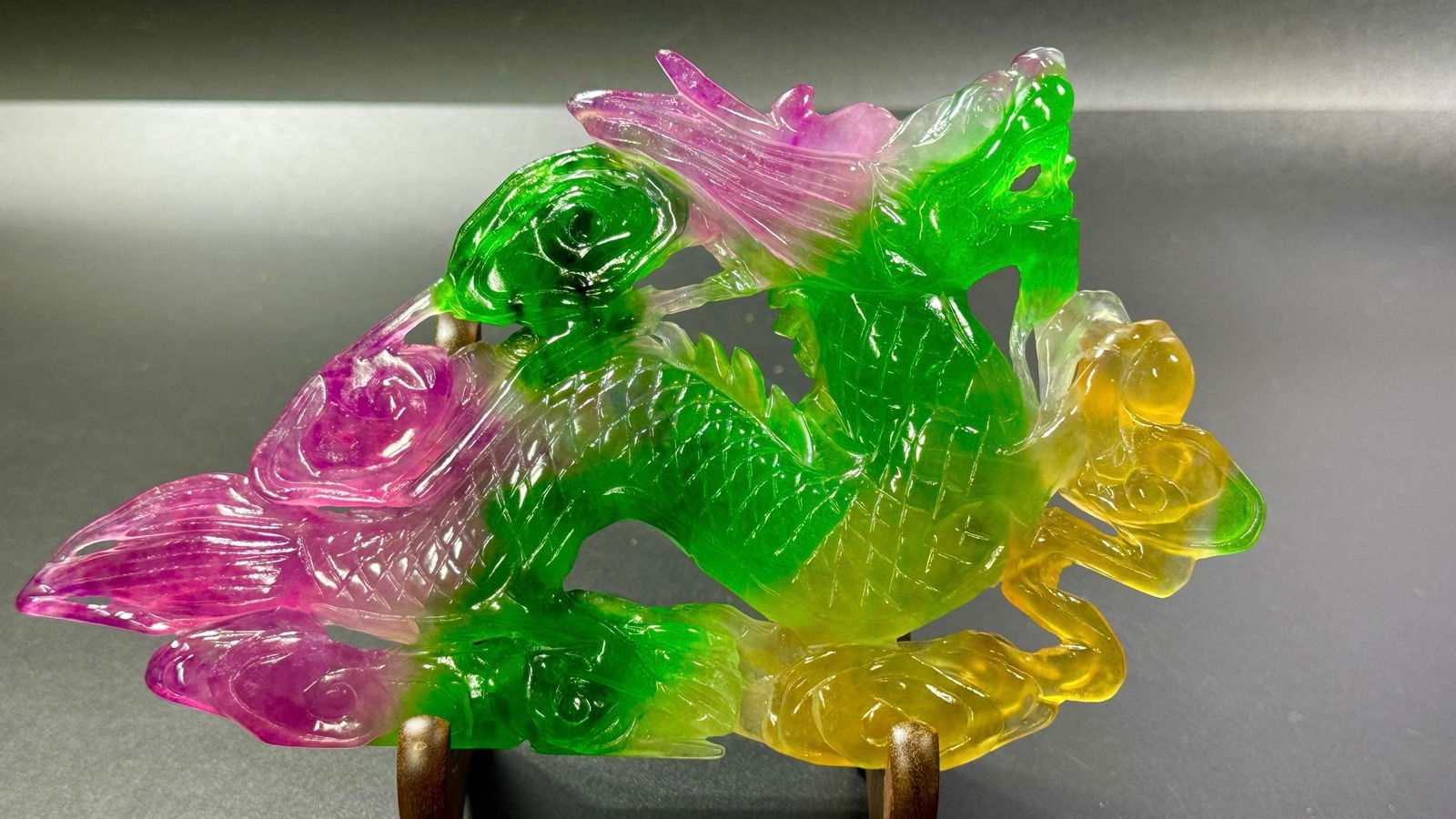 Ice-Transparent Whole Multi-Color Jadeite: Rising Dragon: Ice-Transparent Whole Multi-Color Jadeite Rising Dragon Ornament: Material is ice-transparent multi-color jadeite, carved into "Rising Dragon" theme ornament via relief and openwork techniques,