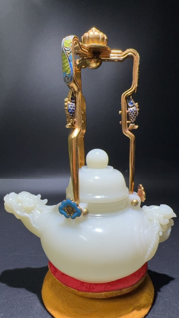 Gilt-Inlaid Hetian White Jade Dragon & Phoenix Ewer: Gilt-Inlaid Hetian White Jade Dragon & Phoenix Ewer: Material is Hetian white jade, matched with gilt handle, enamel inlay and dragon-head spout, craftsmanship integrates jade carving, metal