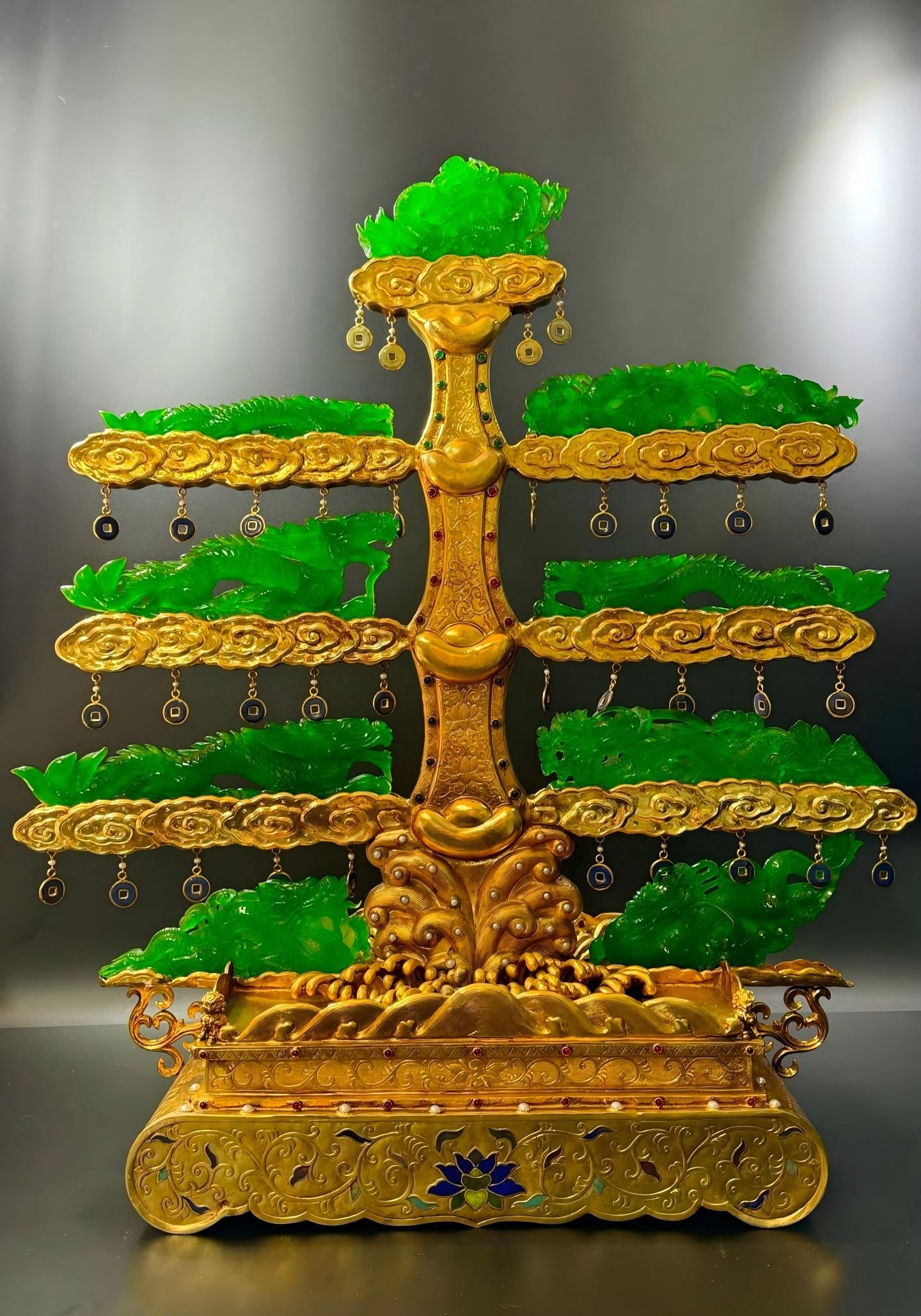 Gilt-Inlaid Solid Jadeite Nine Dragons Ornament: Gilt-Inlaid Integrated Jadeite Nine Dragons: Material is gilt and jadeite, made via gilt, inlay and openwork techniques, jadeite carved with nine dragon patterns, gilt part decorated with cloud and