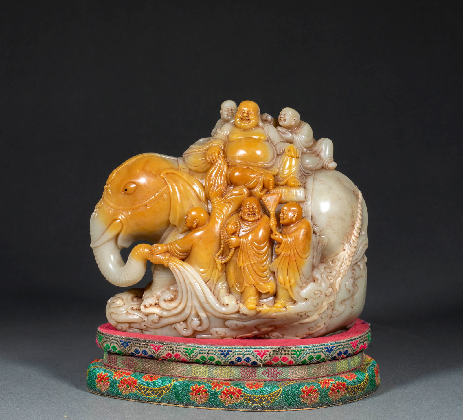 Shoushan Stone Maitreya Buddha Riding White Elephant, Shang Jun Mark: Shoushan Stone Maitreya Buddha Riding a White Elephant, Mark of Shang Jun: Made of Shoushan stone, marked “Shang Jun”, carved with Maitreya Buddha riding a white elephant via round carving, su