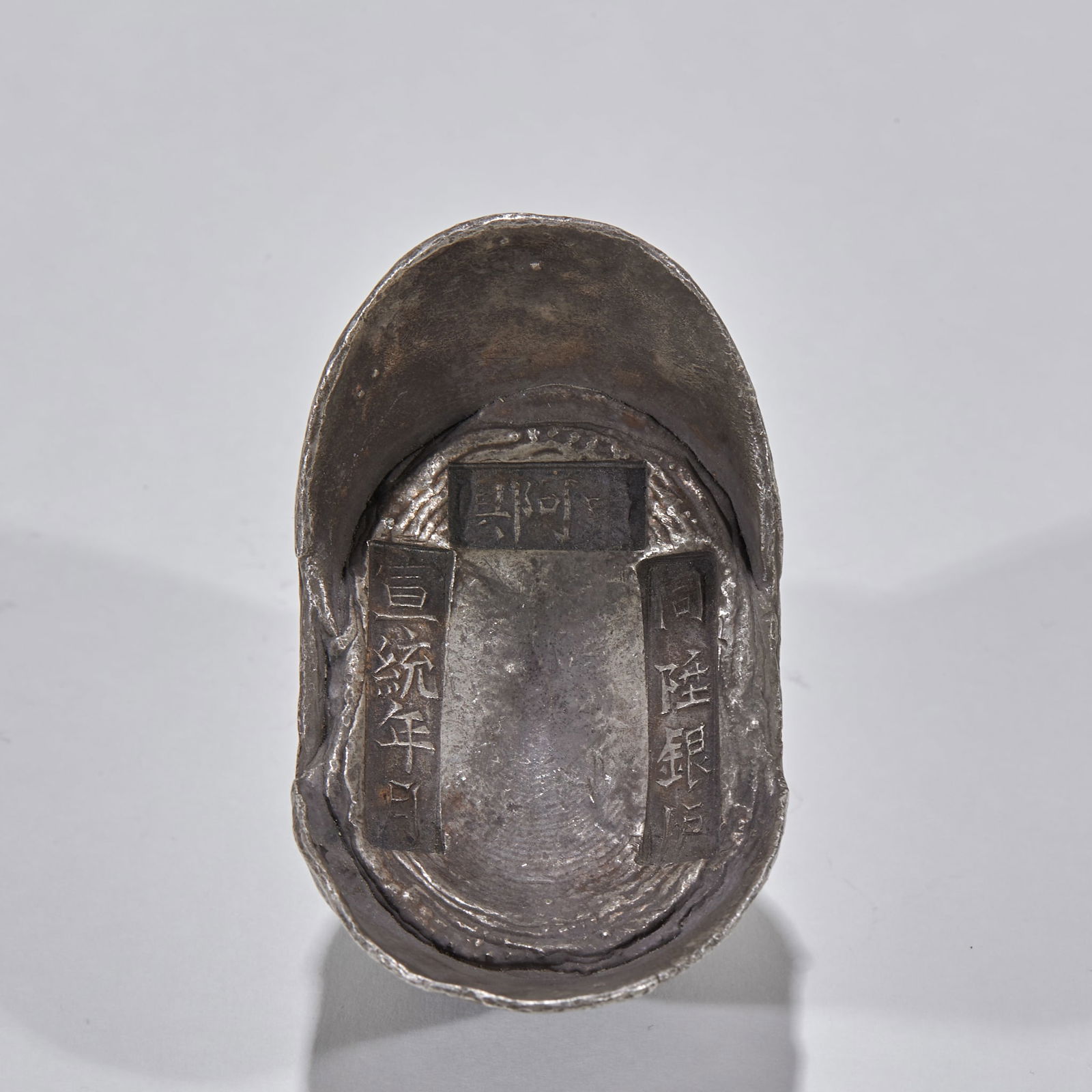 10-Tael Silver Ingot, Dong'e County, Tonglu Silver Furnace, Xuantong Period: Ten?Tael Silver Ingot, Tonglu Silver Furnace, Dong’e County, Xuantong Period: Made of silver via casting, marked with “Xuantong Period”, “Tonglu Silver Furnace” and “Dong’e Count