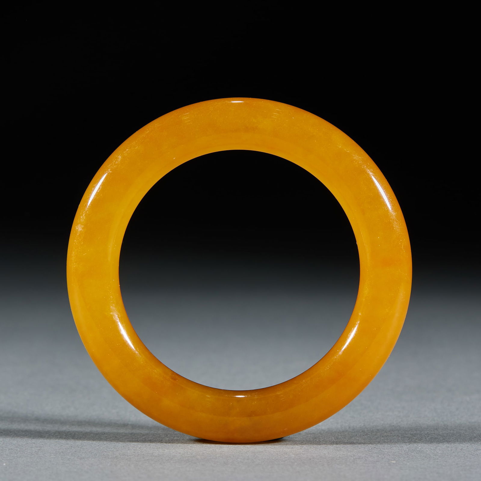 Yellow Jadeite Bangle: Yellow Jadeite Bangle: Material and craftsmanship: natural yellow jadeite bangle in round strip shape, pure and even yellow color, fine jade, well polished; specifications: inner diameter 5.5cm, weigh