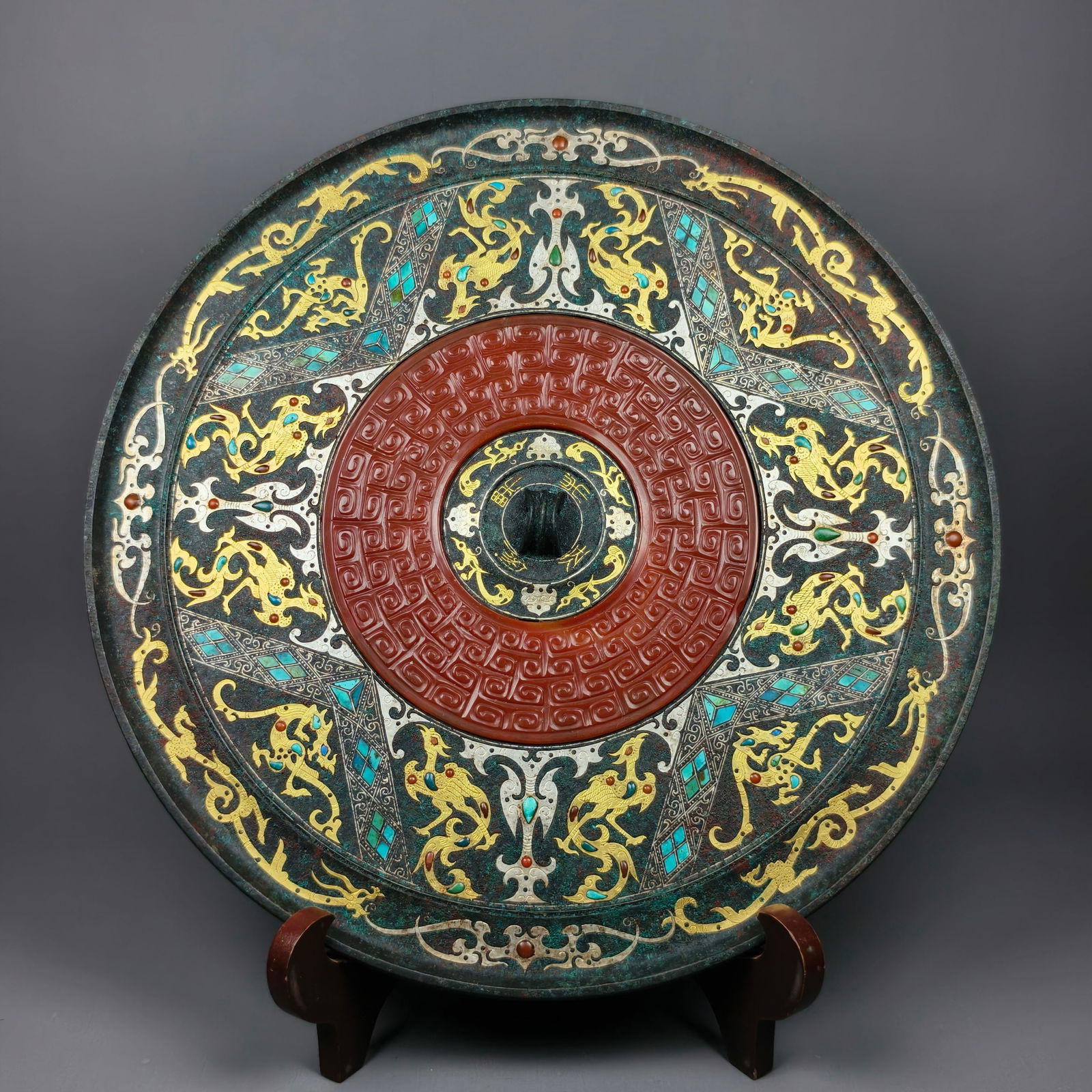 Han Dynasty Gold & Silver Inlaid Jade Bronze Mirror: Han Dynasty Bronze Mirror Inlaid with Gold, Silver and Jade: Material and craftsmanship: bronze casting, inlaid with gemstones and jade via gold-silver inlay technique, complicated patterns,