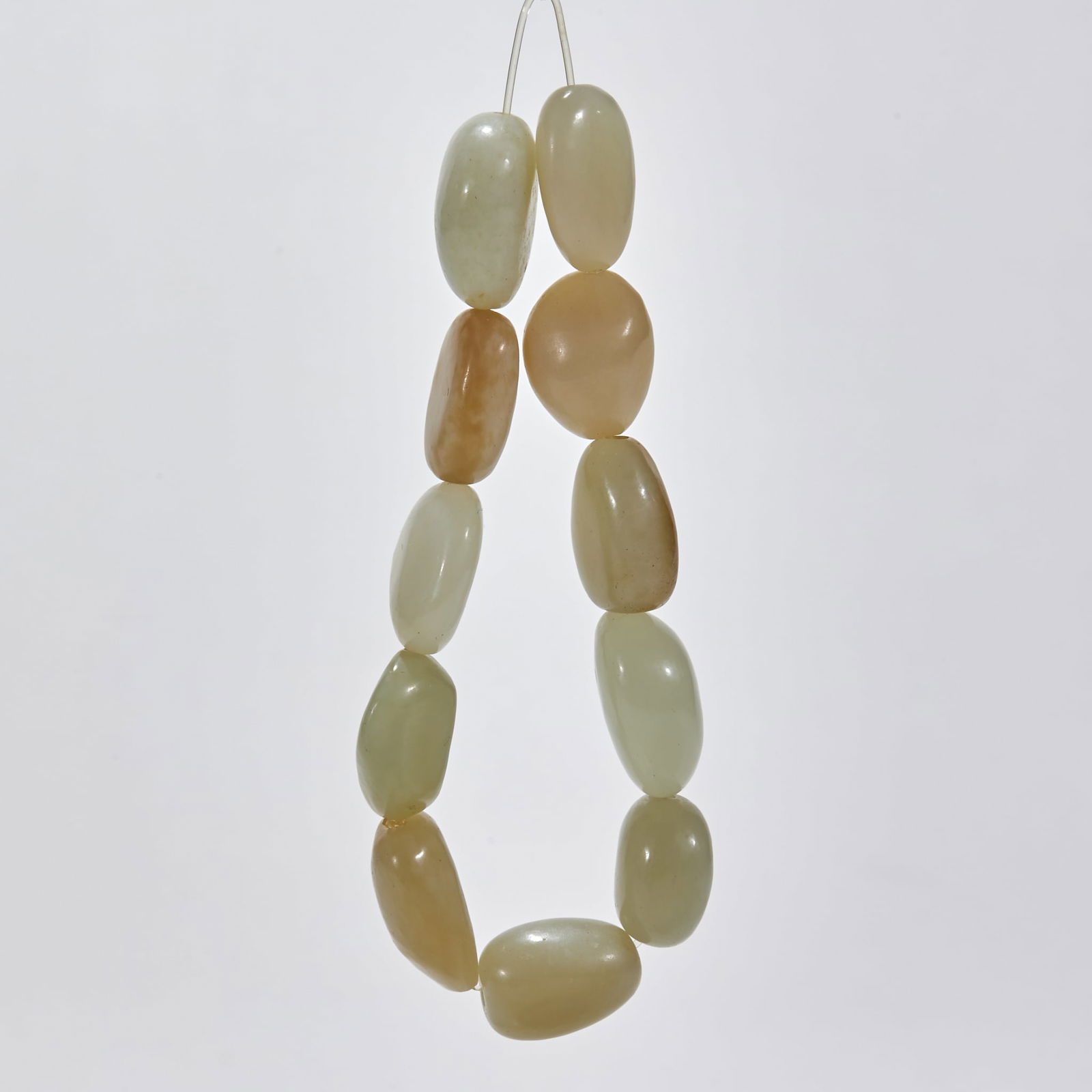 Hetian Jade Rough Stone Bracelet: Hetian Jade Rough Stone Bracelet: Material and craftsmanship: polished from Hetian jade rough stone, warm and fine jade, retaining natural skin color, neatly strung; specifications: single bead